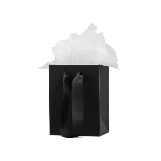 Black gift bag with white tissue paper for elegant gift wrapping