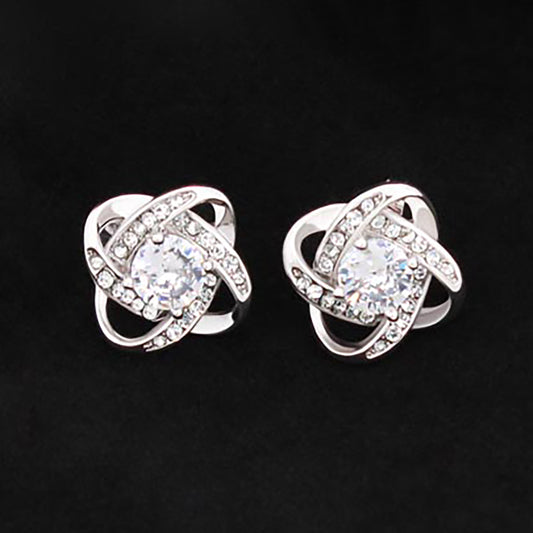 14K White Gold Love Knot Stud Earrings with 6mm CZ Center and Push Backing on Black Background