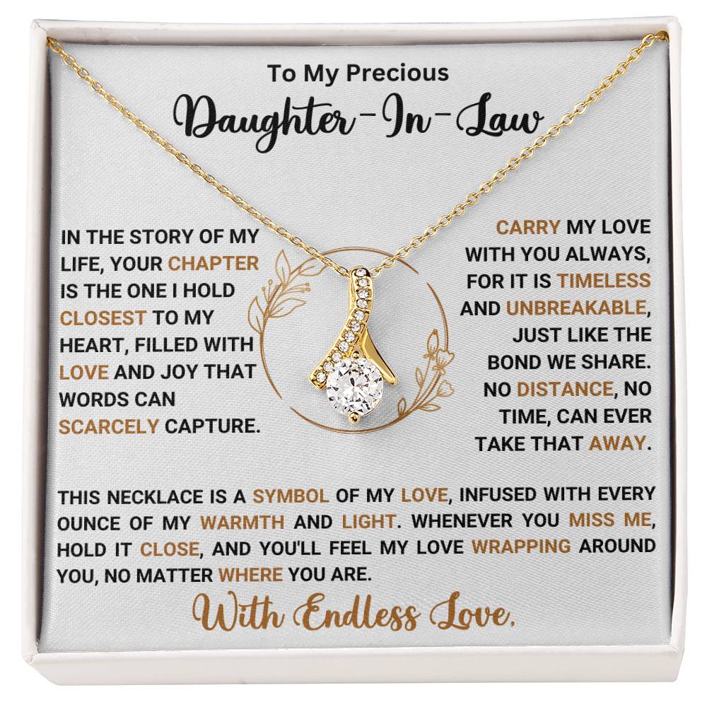 Alluring Beauty necklace gift box for daughter-in-law with heartfelt message and ribbon-shaped pendant.