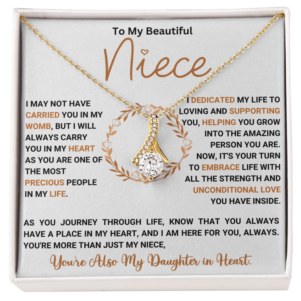 "Alluring Beauty necklace gift set with heartfelt message for niece, featuring elegant ribbon-shaped pendant in a gift box."