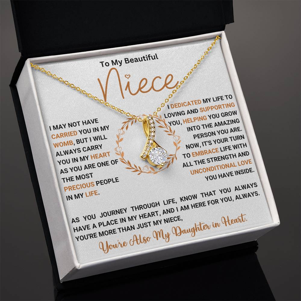 "To My Beautiful Niece necklace with heartfelt message, featuring a gold ribbon-shaped pendant in gift box"