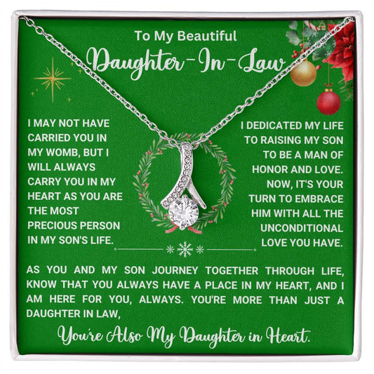 Christmas necklace gift for daughter-in-law with heartfelt message and elegant ribbon-shaped pendant.