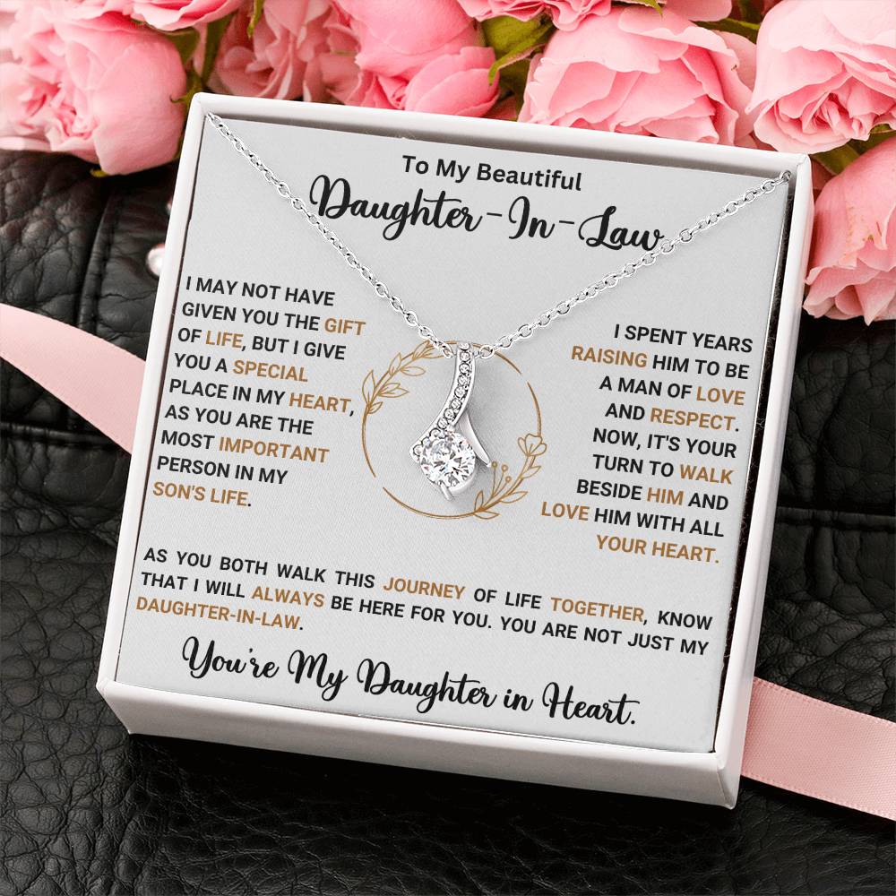 Alluring Beauty necklace gift for daughter-in-law with heartfelt message and ribbon-shaped pendant in decorative box.