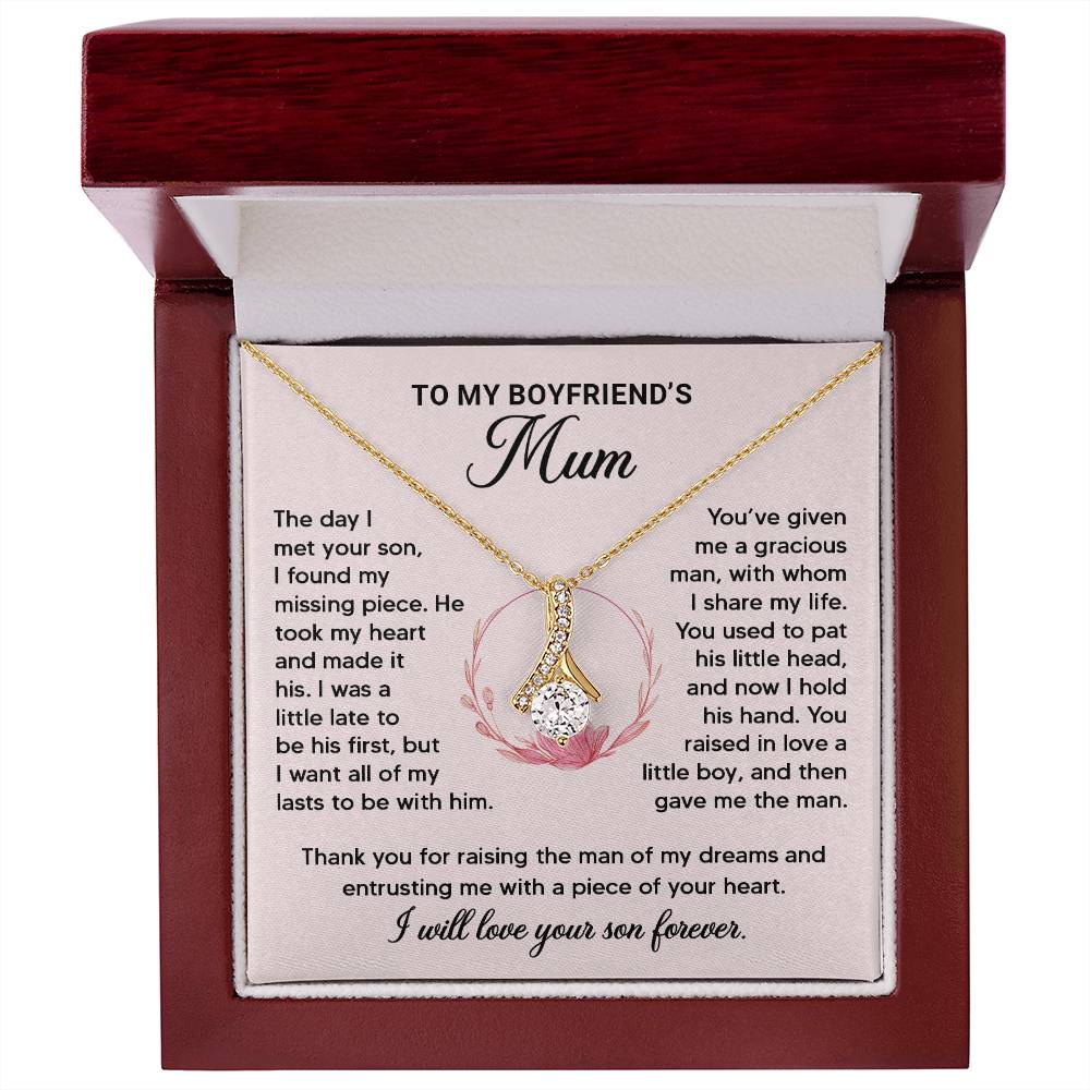 Gold ribbon pendant necklace in a gift box with heartfelt message for boyfriend's mum. Perfect appreciation gift.