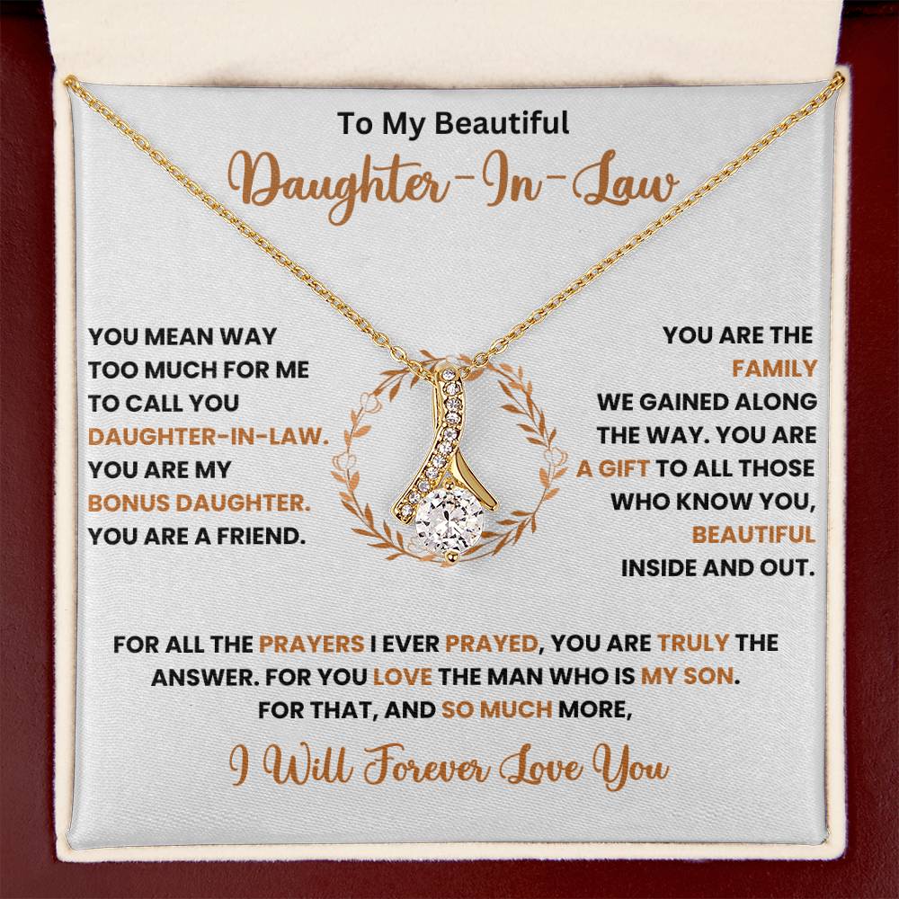 Alluring Beauty necklace with a ribbon-shaped pendant in a gift box for a daughter-in-law, featuring loving message and 14k gold finish.