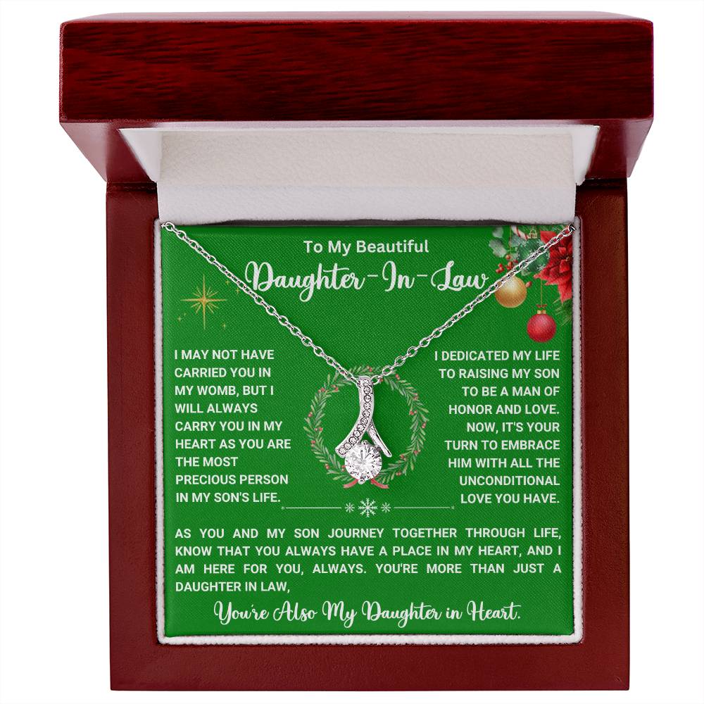 Alluring Beauty necklace in gift box with heartfelt message for daughter-in-law, ribbon-shaped pendant, perfect Christmas gift.