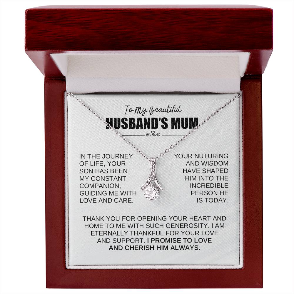 Alluring Beauty necklace for husband's mum, featuring a ribbon pendant in a gift box with heartfelt message.