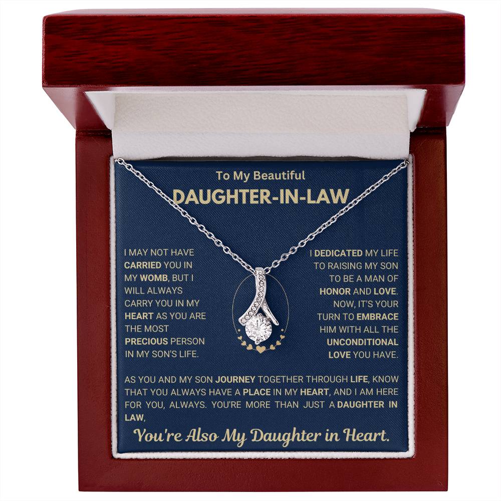 Alluring Beauty necklace with message to daughter-in-law, displayed in an open wooden box.