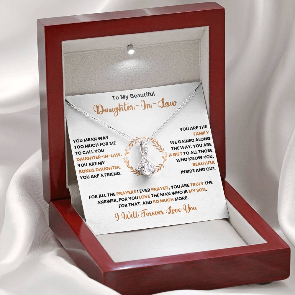 Alluring Beauty necklace with ribbon pendant in gift box for daughter-in-law, featuring a heartfelt message.