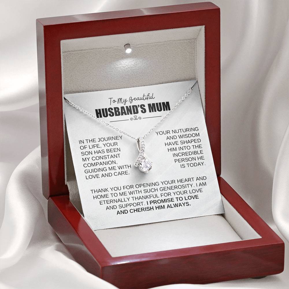 Alluring Beauty necklace in a gift box for Husband’s Mum with heartfelt message and ribbon-shaped pendant.