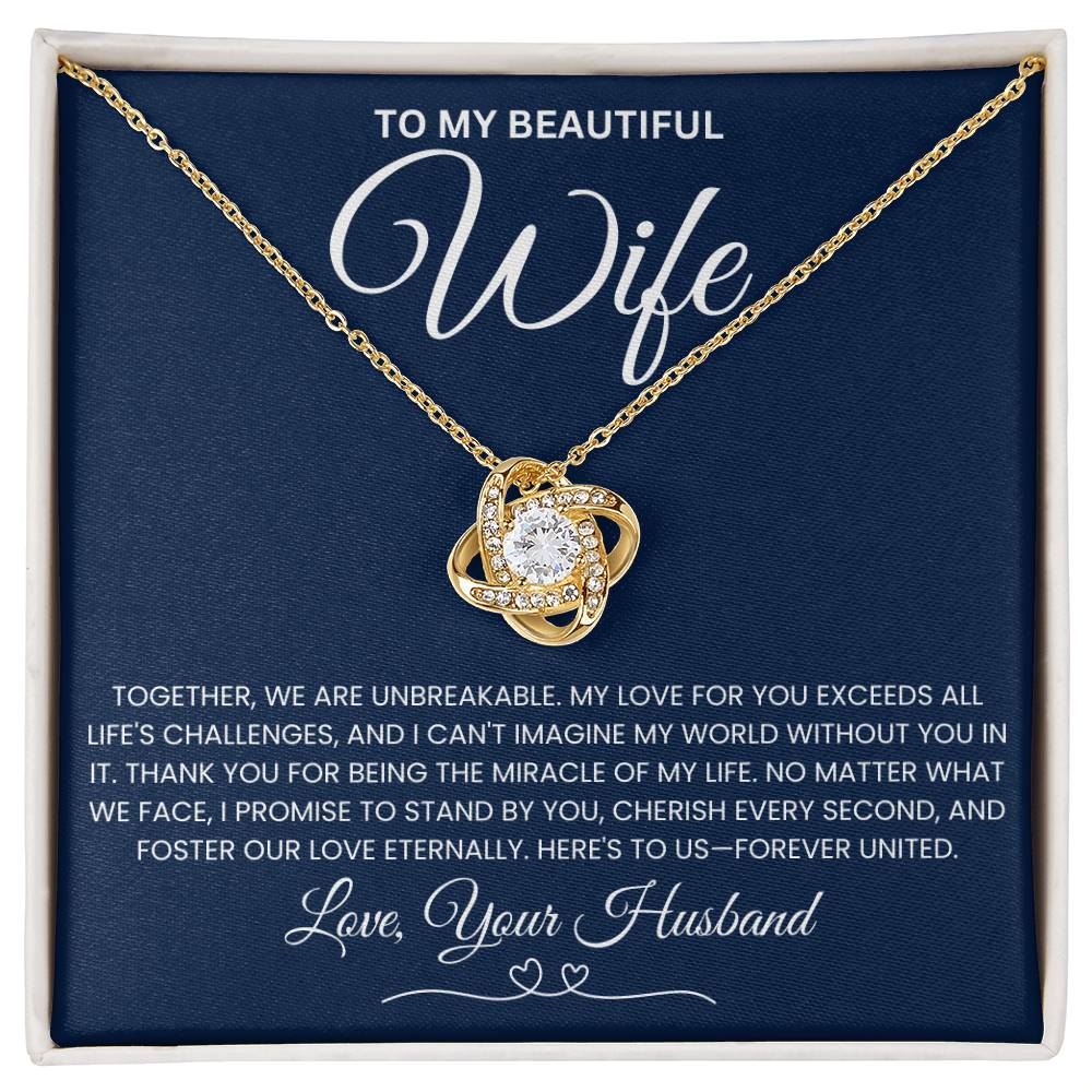 Love Knot Necklace with heartfelt message for wife, featuring a cubic zirconia pendant and gold chain on a sentimental gift card.