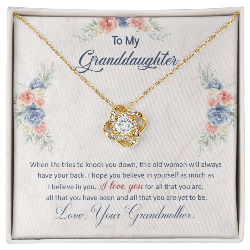 Love Knot Necklace for Granddaughter with sentimental message from Grandmother, featuring a pendant with cubic zirconia crystals in gold setting.