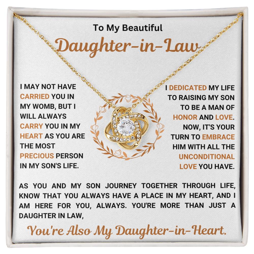 Love Knot Necklace with heartfelt message for daughter-in-law, featuring cubic zirconia crystals, 14k white gold over stainless steel or 18k yellow gold over.