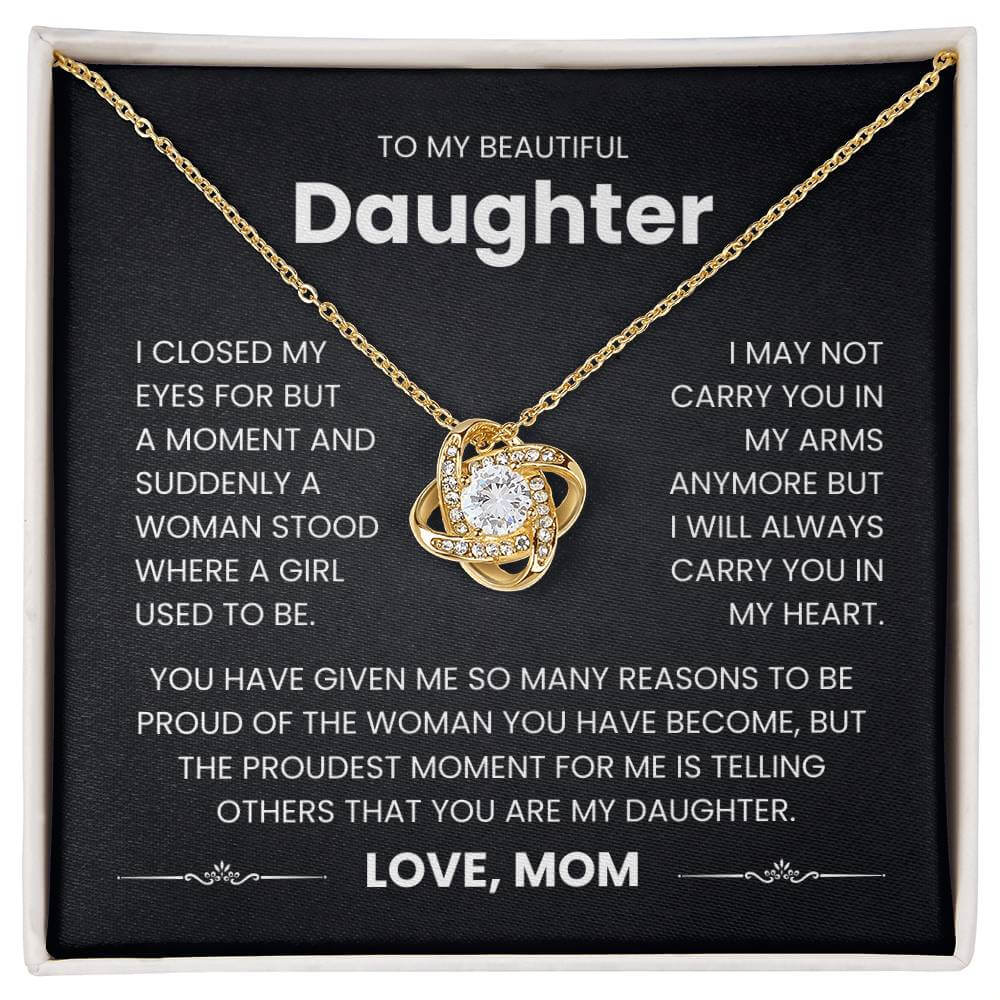 Love Knot Necklace for Daughter with heartfelt message from mom - "Carry You in My Heart" on gift card background.