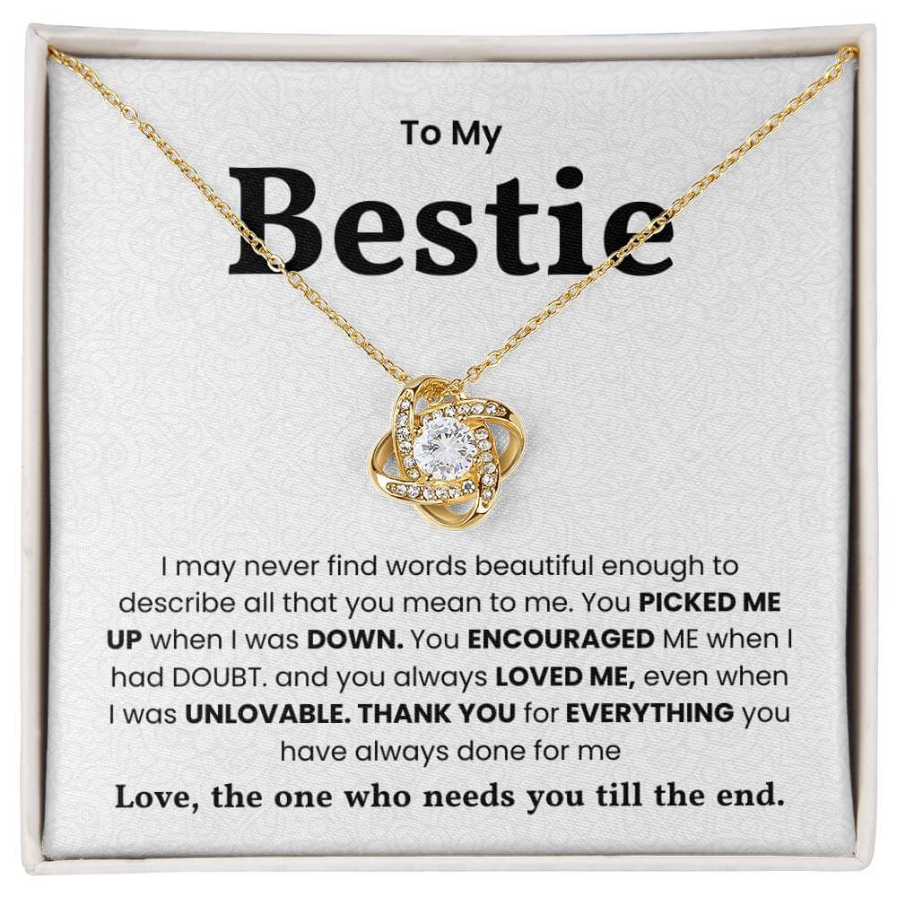 Love Knot Necklace for Bestie with heartfelt message, gold chain, and shimmering pendant in a gift box.