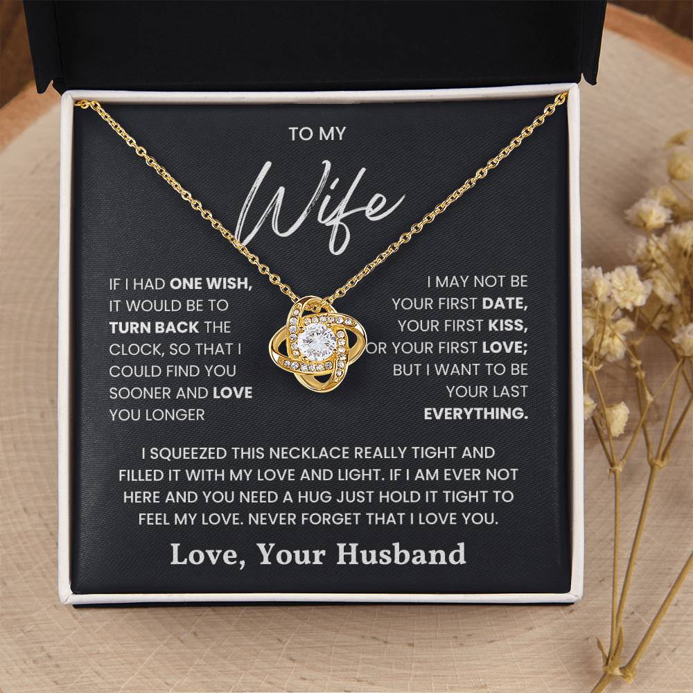 Love Knot Necklace in gift box with heartfelt message for wife, featuring a gold chain and sparkling central pendant.