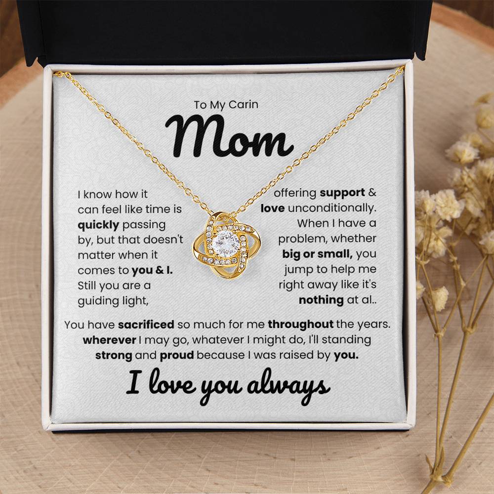 Love Knot Necklace for Mom with heartfelt message about unconditional support and love. Gift box with note saying "I love you always."