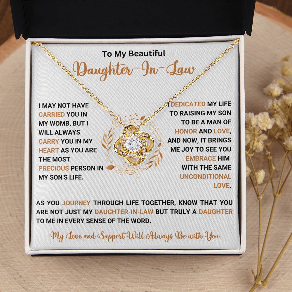 Love knot necklace gift for daughter-in-law with heartfelt message, perfect for cherished family moments and expressing unconditional love