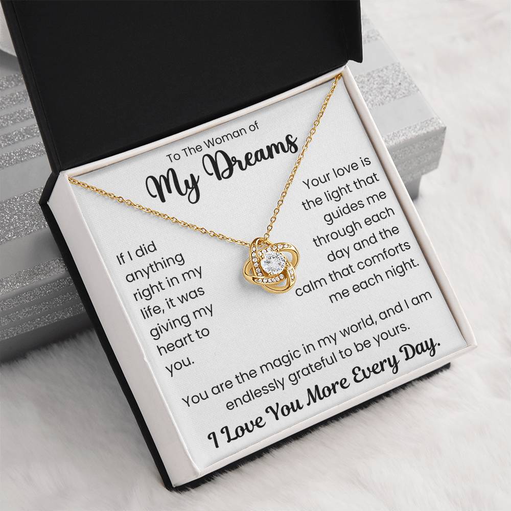 Love Knot Necklace in gift box with 'To The Woman of My Dreams - I Love You More Every Day' inscription, featuring cubic zirconia crystals.