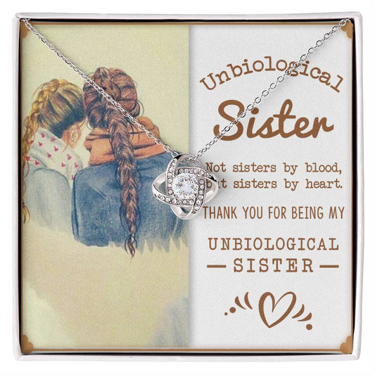 "To My Unbiological Sister Love Knot Necklace with cubic zirconia crystals, heartfelt gift box with message 'Not sisters by blood, but sisters by heart'"