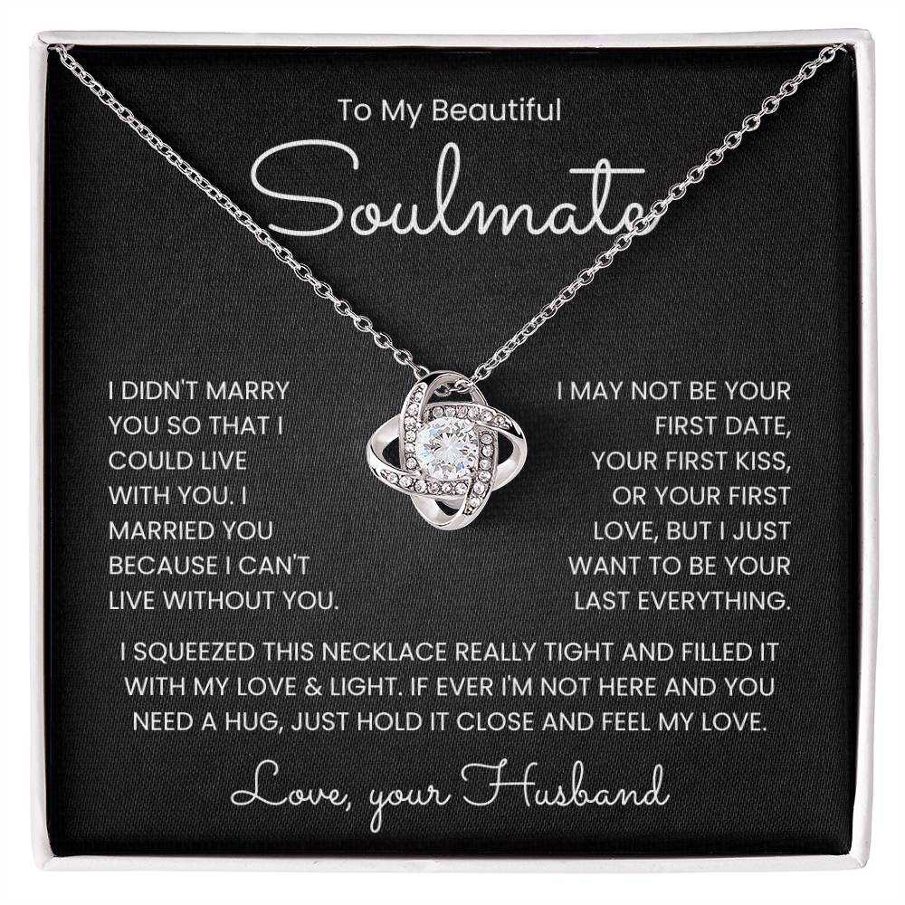 Love Knot Necklace with heartfelt message for soulmate on a black background.