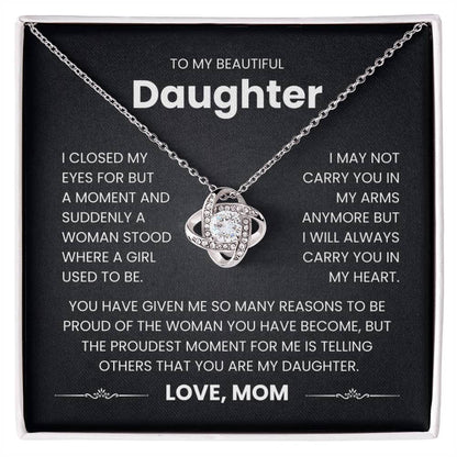 Love Knot Necklace gift for daughter with heartfelt message from mom about carrying her in heart, displayed in a box.