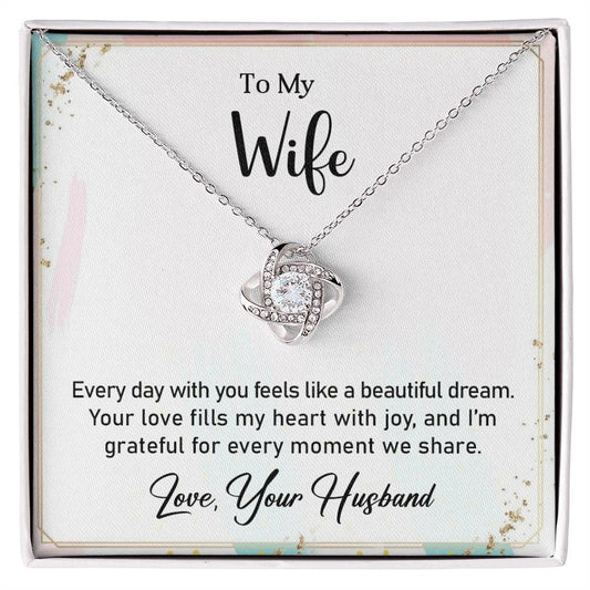 Love Knot Necklace with heartfelt message for wife, featuring cubic zirconia, perfect gift for a special occasion.