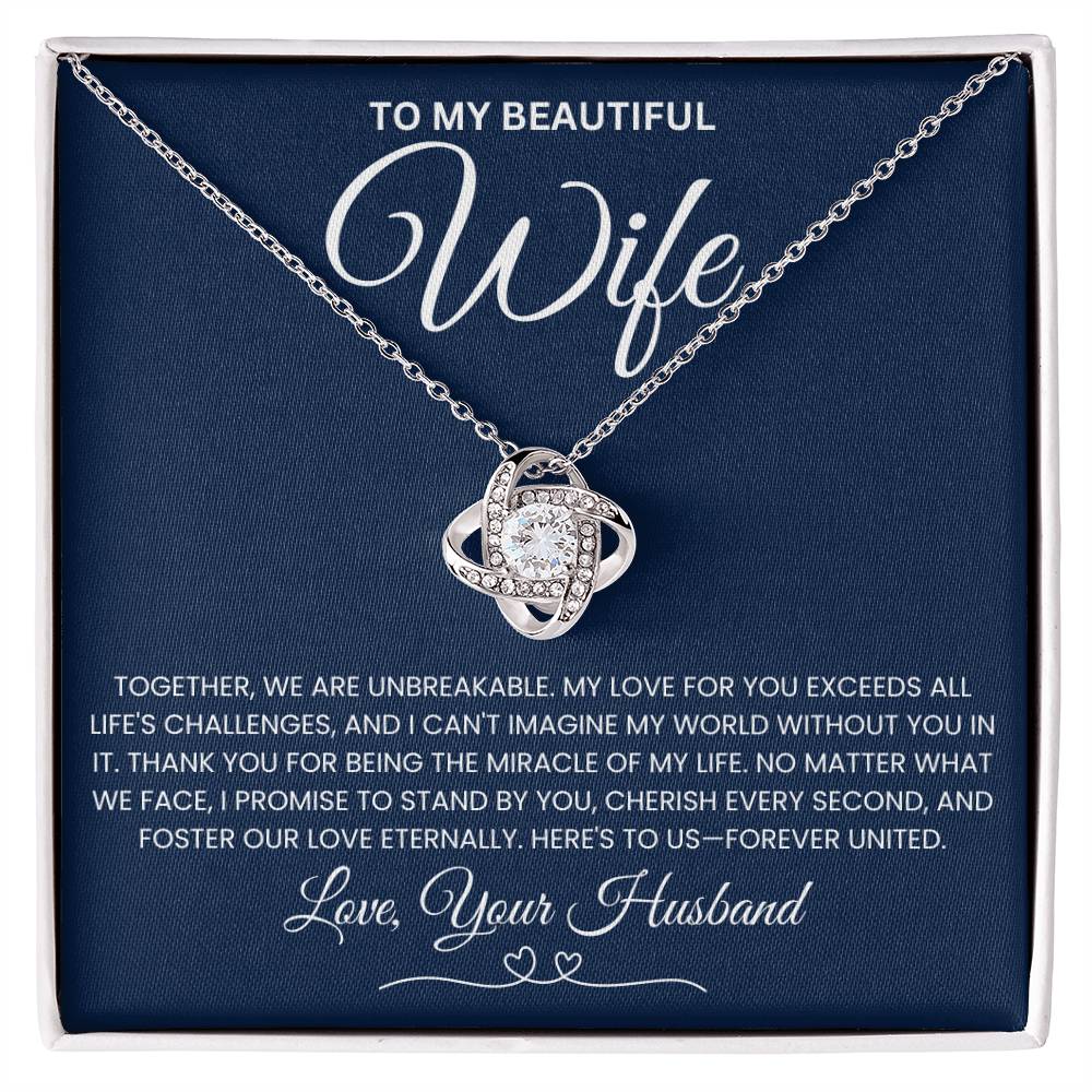 Love Knot Necklace with message "To My Beautiful Wife" on navy gift box background