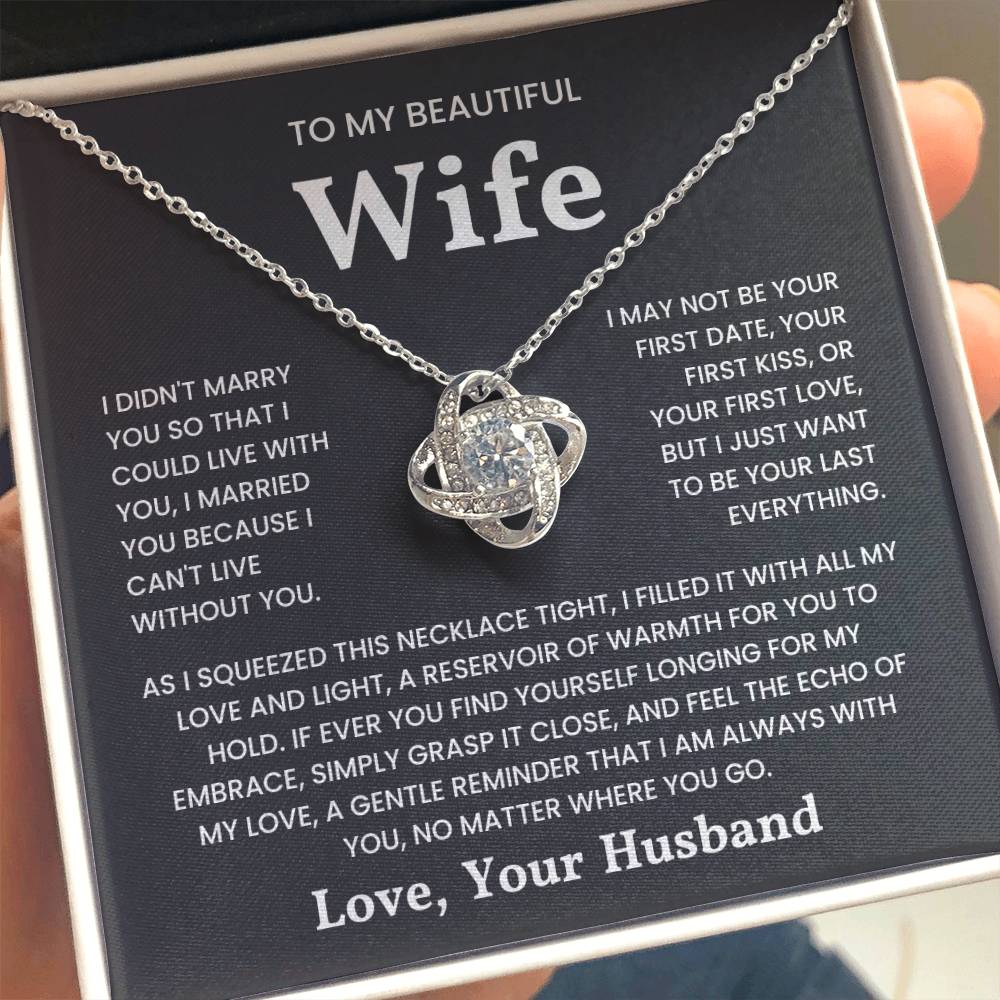 Love knot necklace with heartfelt message for wife, "I married you because I can't live without you," from husband in gift box.