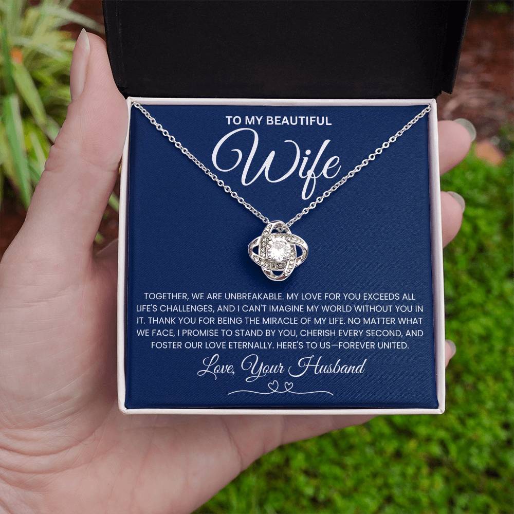 Elegant love knot necklace for wife in gift box with heartfelt message, featuring cubic zirconia on white gold chain.