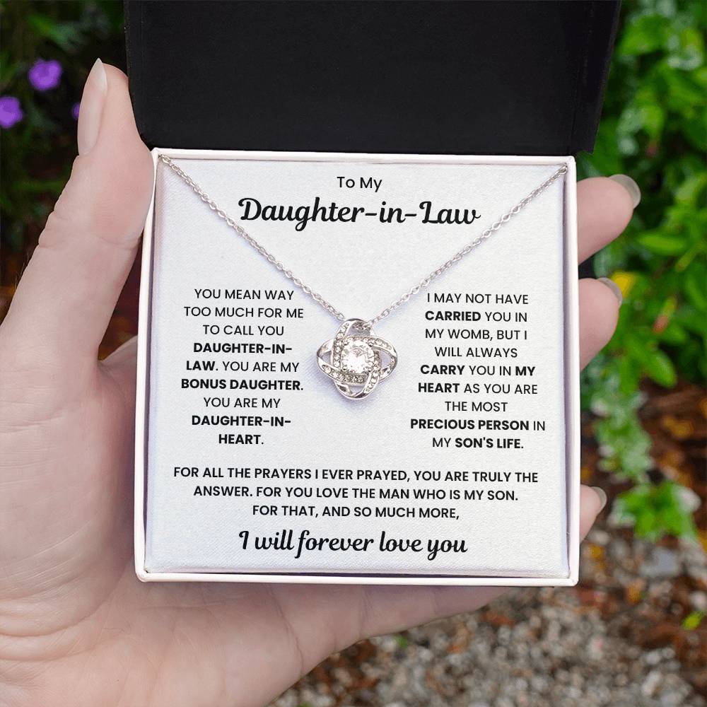 Love Knot Necklace gift for daughter-in-law with heartfelt message in decorative box held in hand