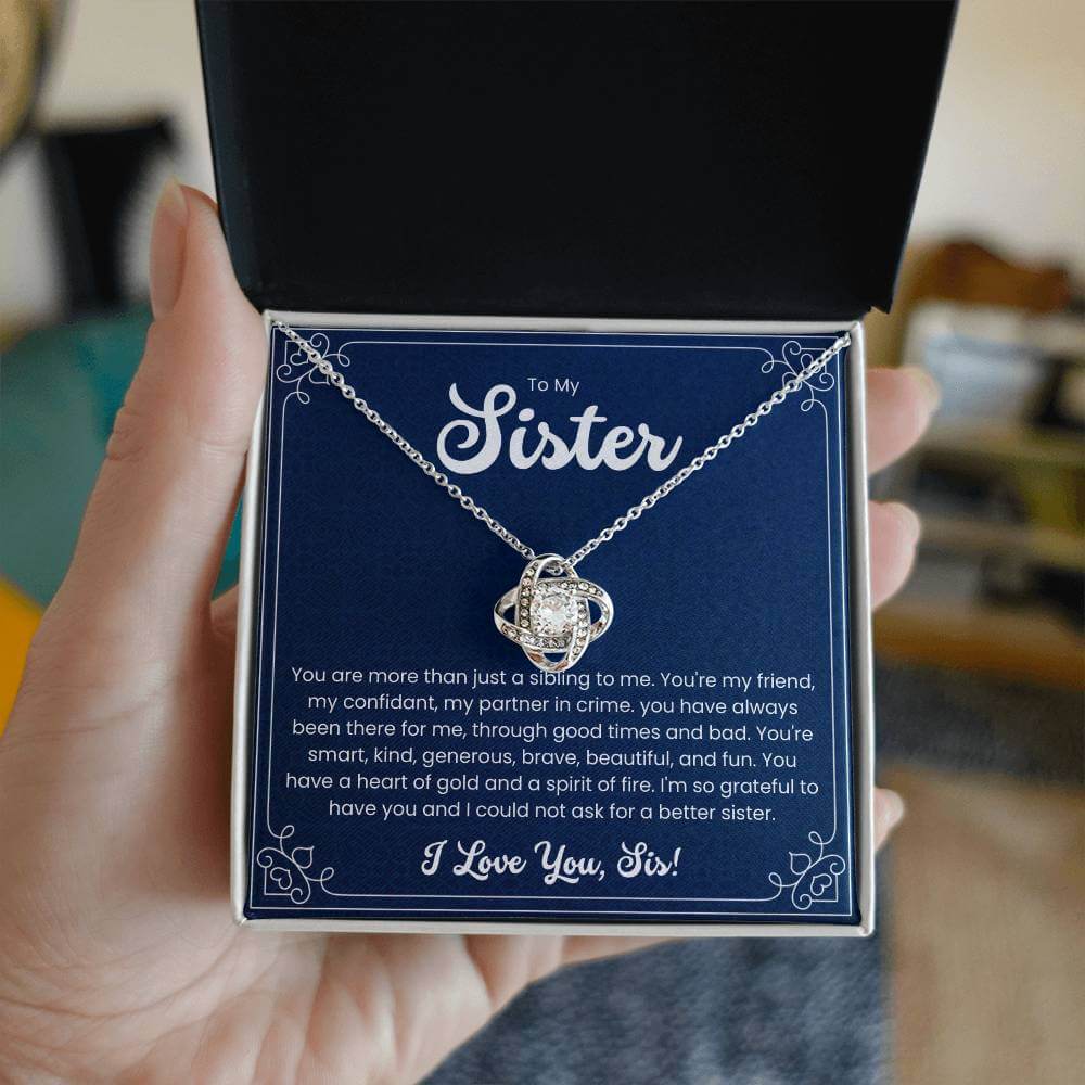 Love Knot Necklace for Sister with heartfelt message in gift box, perfect for expressing sibling love and appreciation