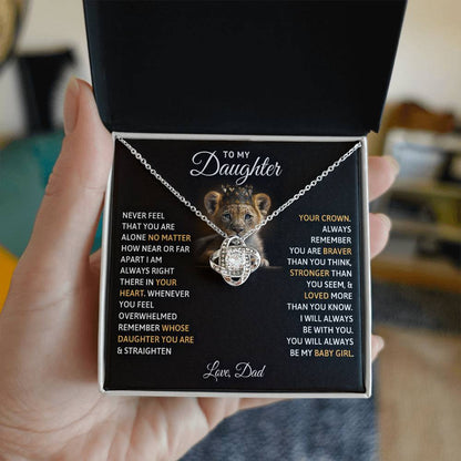 Hand holding a Love Knot Necklace in a gift box with a heartfelt message, perfect gift for daughters, featuring cubic zirconia stones and cute bear design.