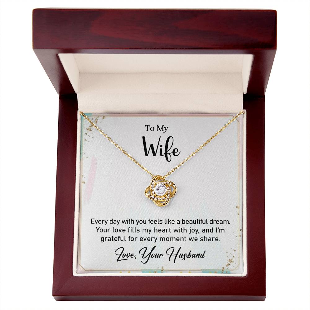 Love Knot Necklace with heartfelt message for wife in a wooden gift box, featuring a cubic zirconia pendant, perfect anniversary gift.