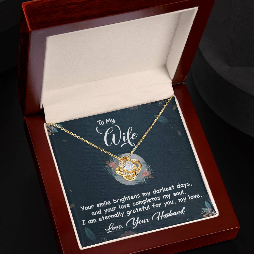 Love Knot Necklace in gift box with heartfelt message card for wife, featuring cubic zirconia and gold finish. Perfect romantic gift.