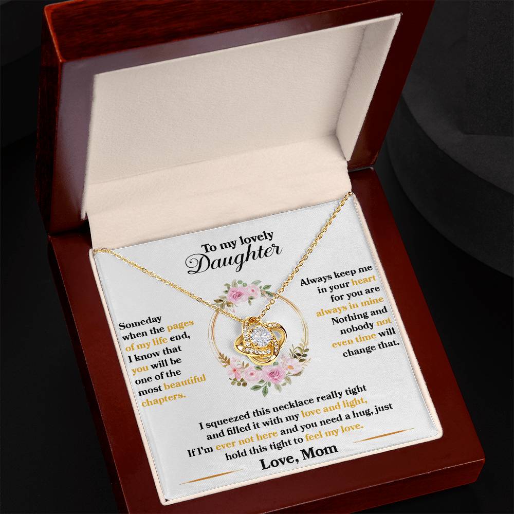 Gold Love Knot Necklace with cubic zirconia in an elegant box, gift for daughter, representing unbreakable bond, heartfelt message from mom.