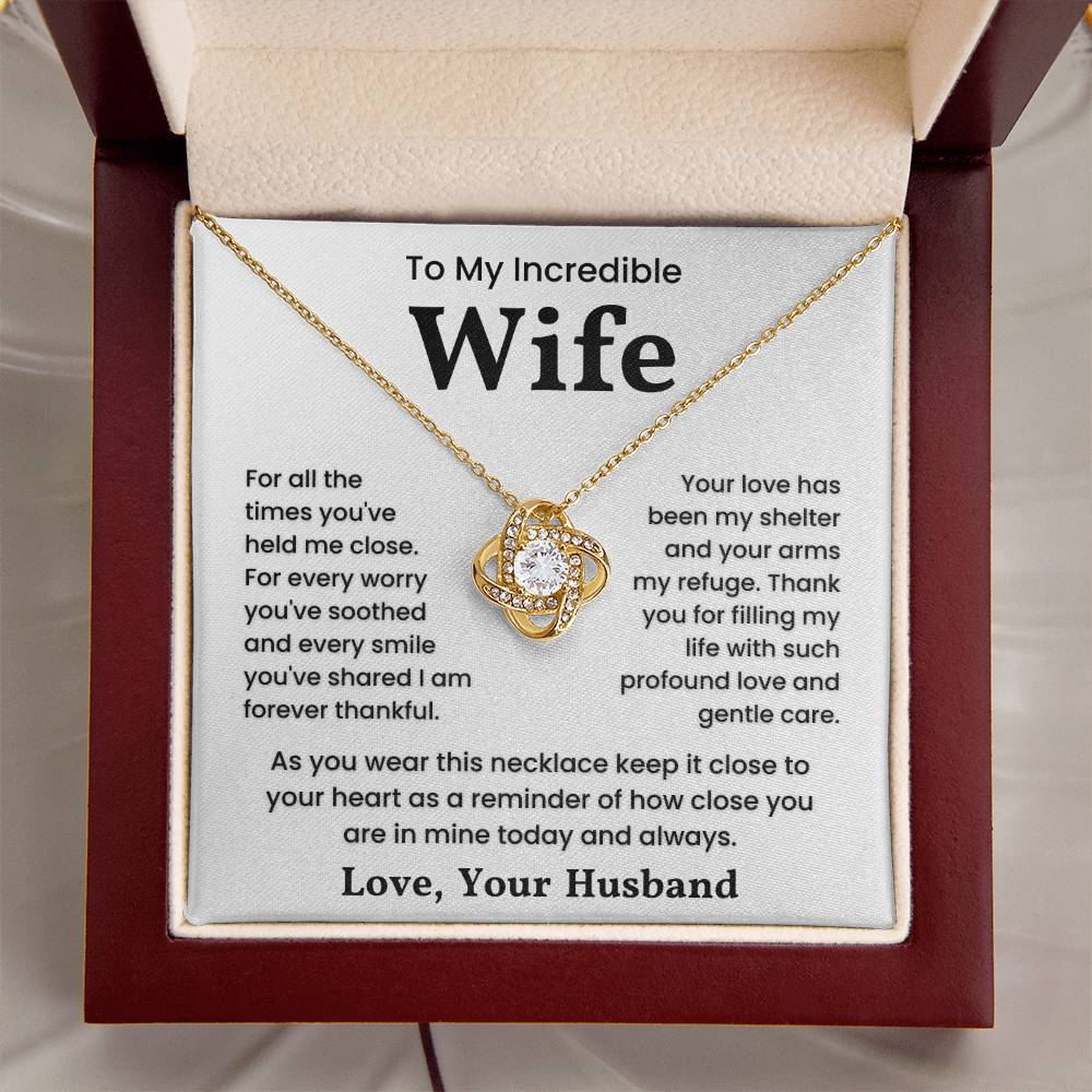 Gold love knot necklace with heartfelt message to wife in gift box.