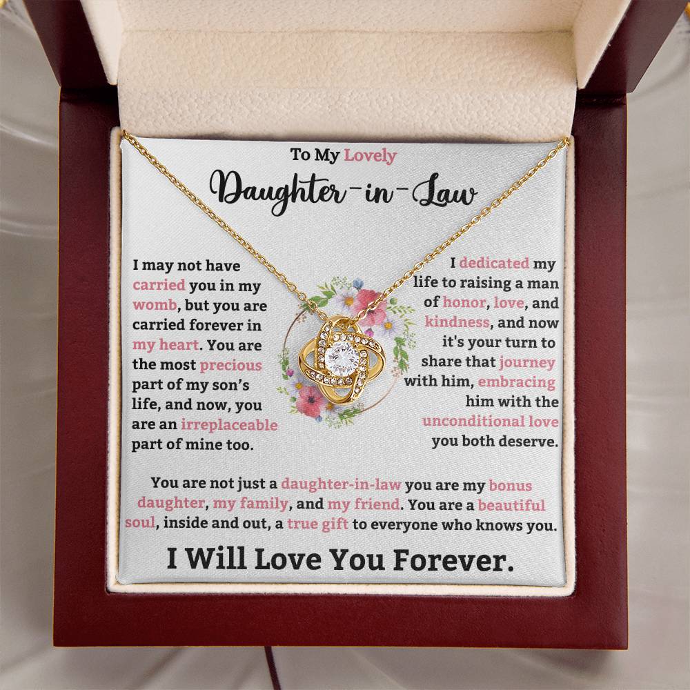 Love Knot Necklace in a gift box with a heartfelt message for daughter-in-law, featuring gold chain and cubic zirconia pendant.