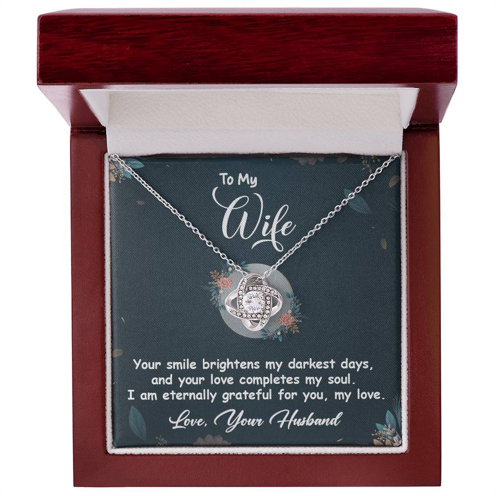 Love Knot Necklace in gift box for wife, with message "Your smile brightens my darkest days," featuring cubic zirconia pendant.