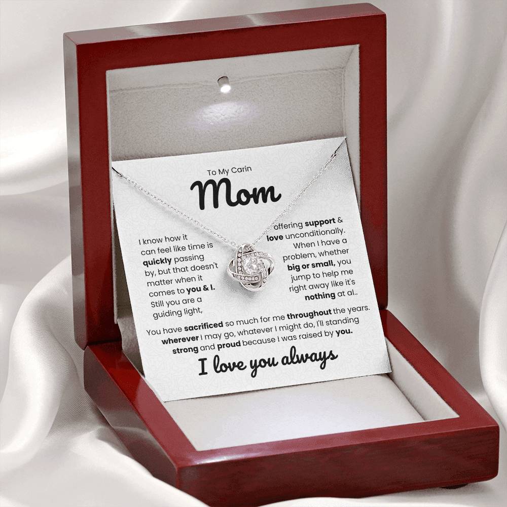 Love Knot Necklace for Mom with heartfelt message in a red jewelry box, saying "To My Carin Mom, offering support & love unconditionally. I love you always."