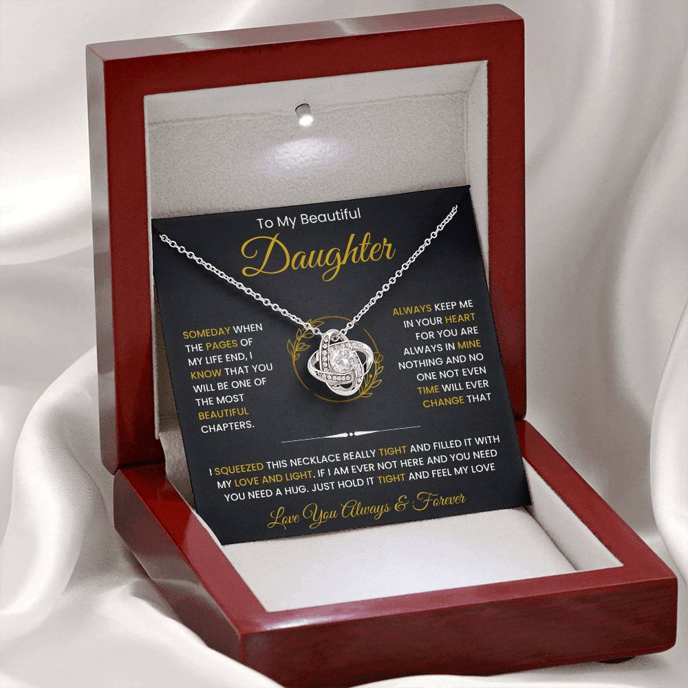 To My Beautiful Daughter necklace in wooden box, perfect gift from dad or mom, featuring a love knot pendant with cubic zirconia crystals.