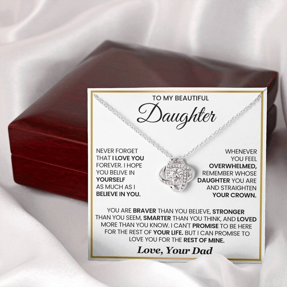 Love Knot Necklace for Daughter with Inspirational Message from Dad, featuring premium cubic zirconia on a card with wooden box background.