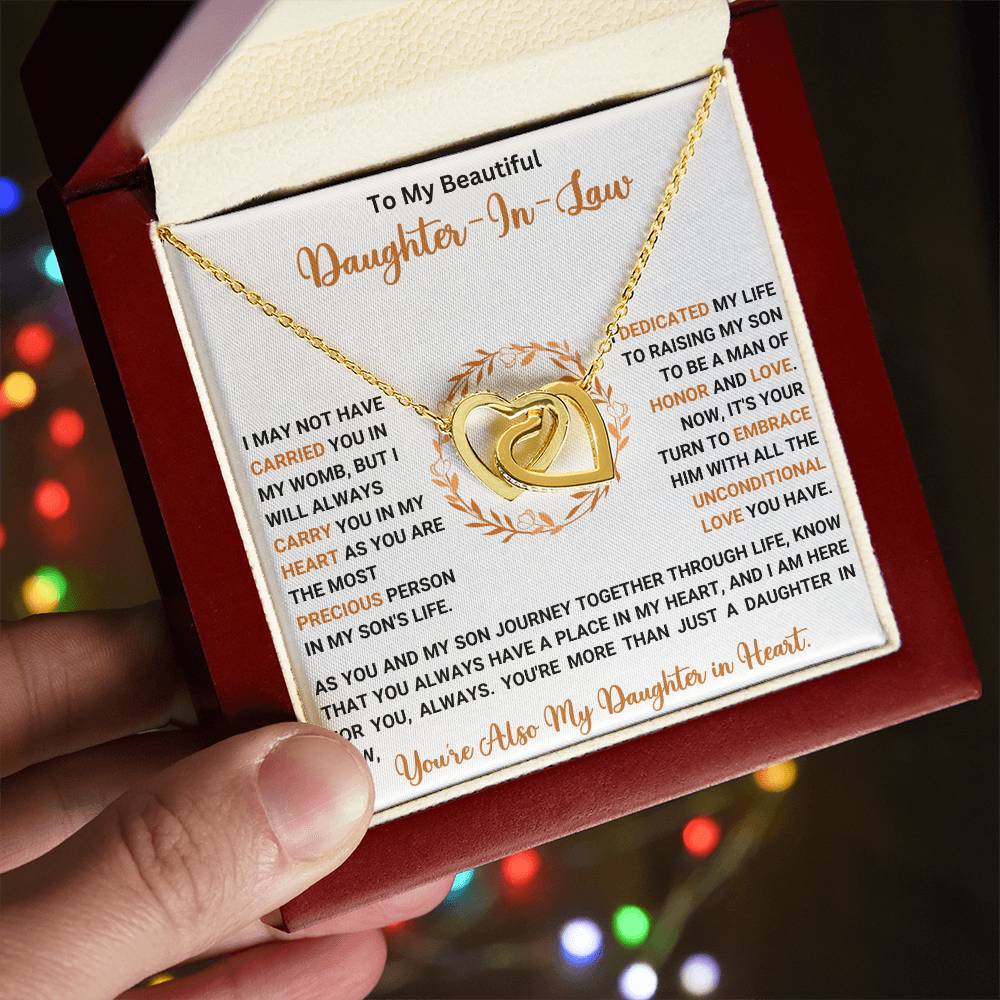 Gold interlocking hearts necklace for daughter-in-law presented in a red box with heartfelt message card.