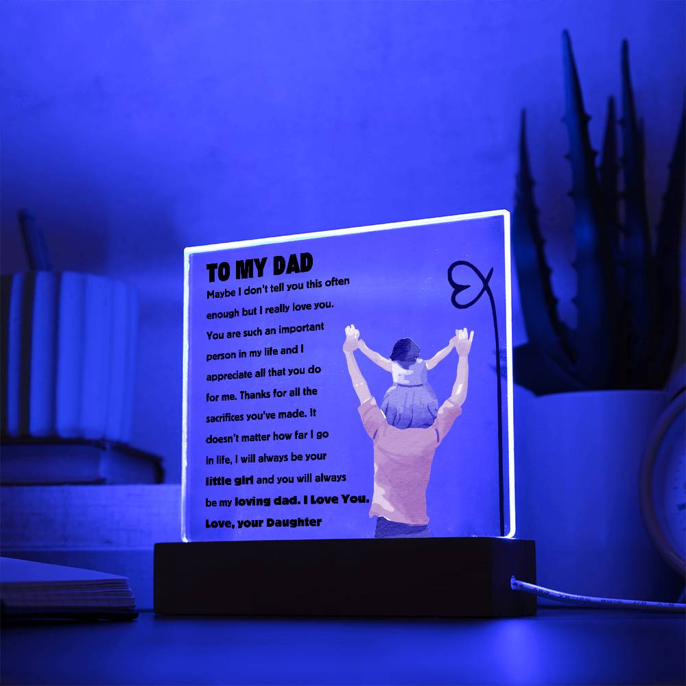 Square acrylic plaque with heartfelt message to dad illuminated in a blue room, featuring a father and daughter graphic.