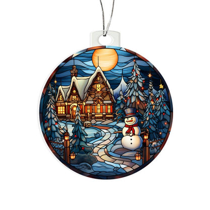 Christmas acrylic ornament with snowman, cozy cottage, and twinkling lights on a snowy night under the full moon.