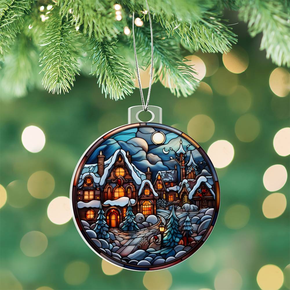 Christmas acrylic ornament with moonlit village design hanging on tree, showcasing snow-covered cottages and glowing lights.