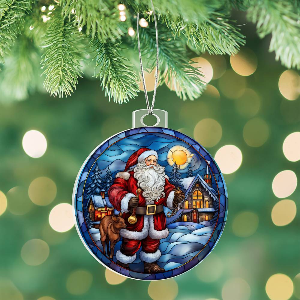 Christmas acrylic ornament featuring Santa, cozy cabin, and snow-covered trees, capturing a winter sunset's charm.