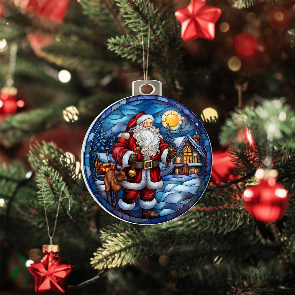 Christmas acrylic ornament featuring Santa with a cozy cabin and snowy landscape, hanging on a decorated Christmas tree.