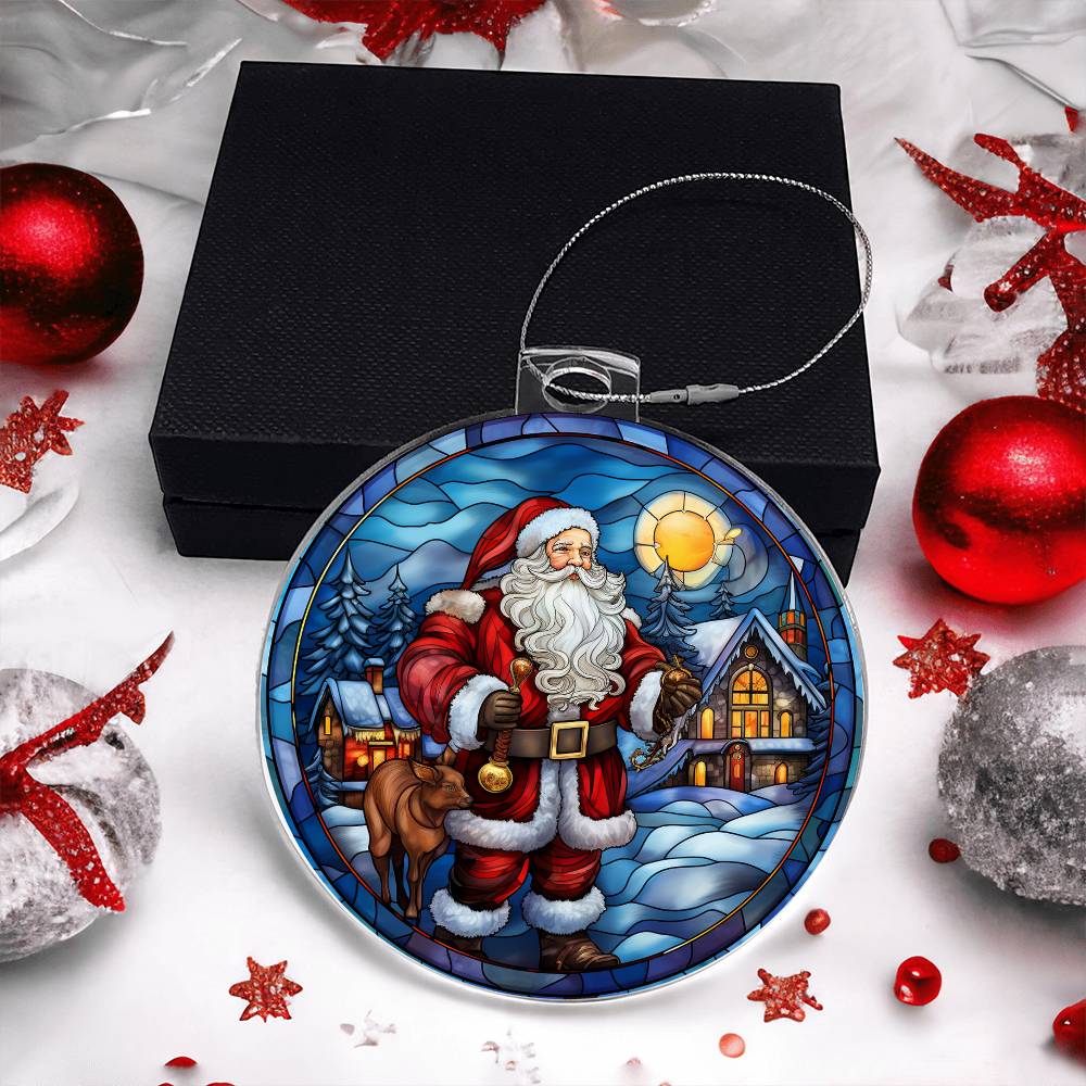 Christmas acrylic ornament featuring Santa, cozy cabin, and snow-covered trees, highlighting a winter sunset, with gift box.