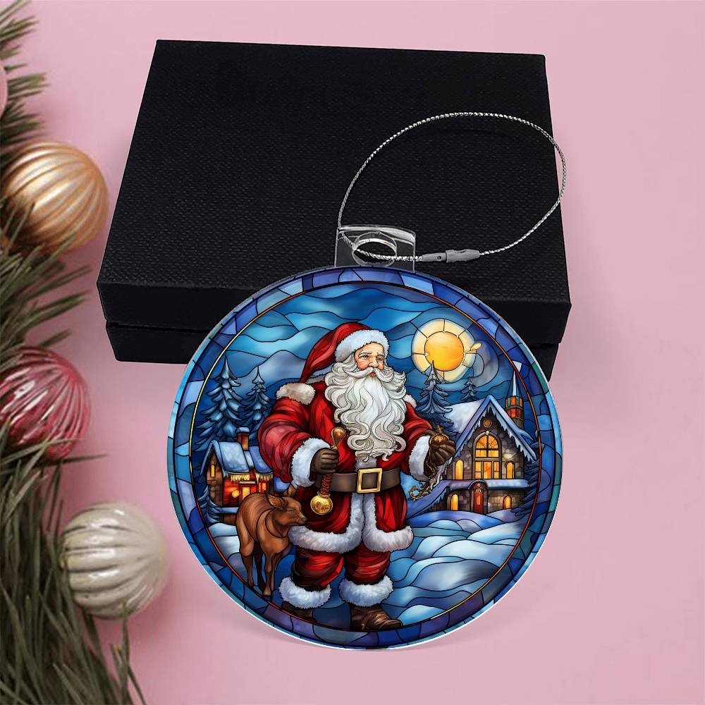 Christmas acrylic ornament with Santa, cozy cabin, and snow-covered trees against a sunset sky, perfect for holiday decor.